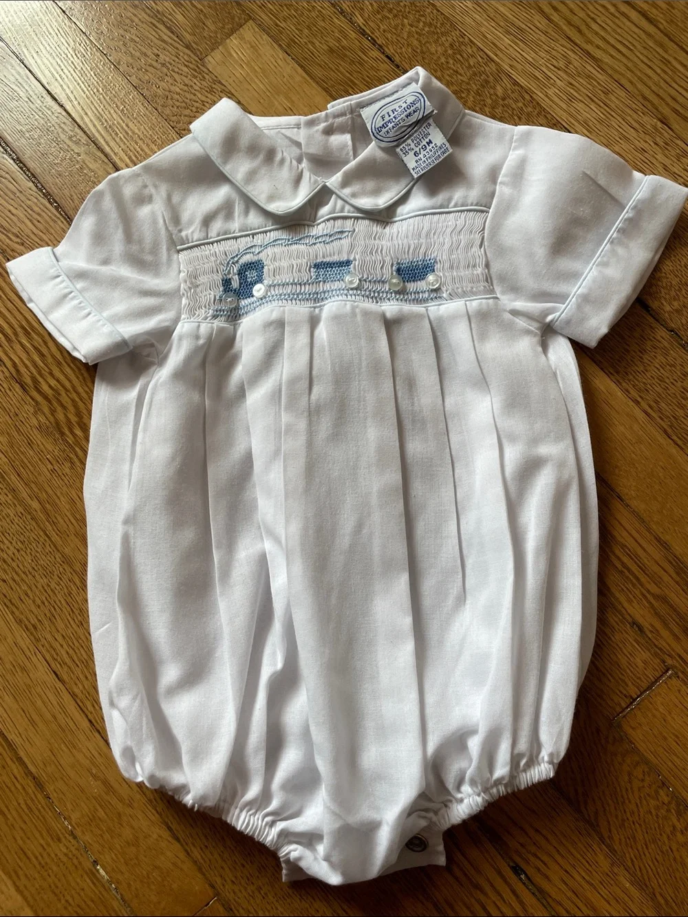 White Baby Bubble Romper with Blue Smocked Train Detail